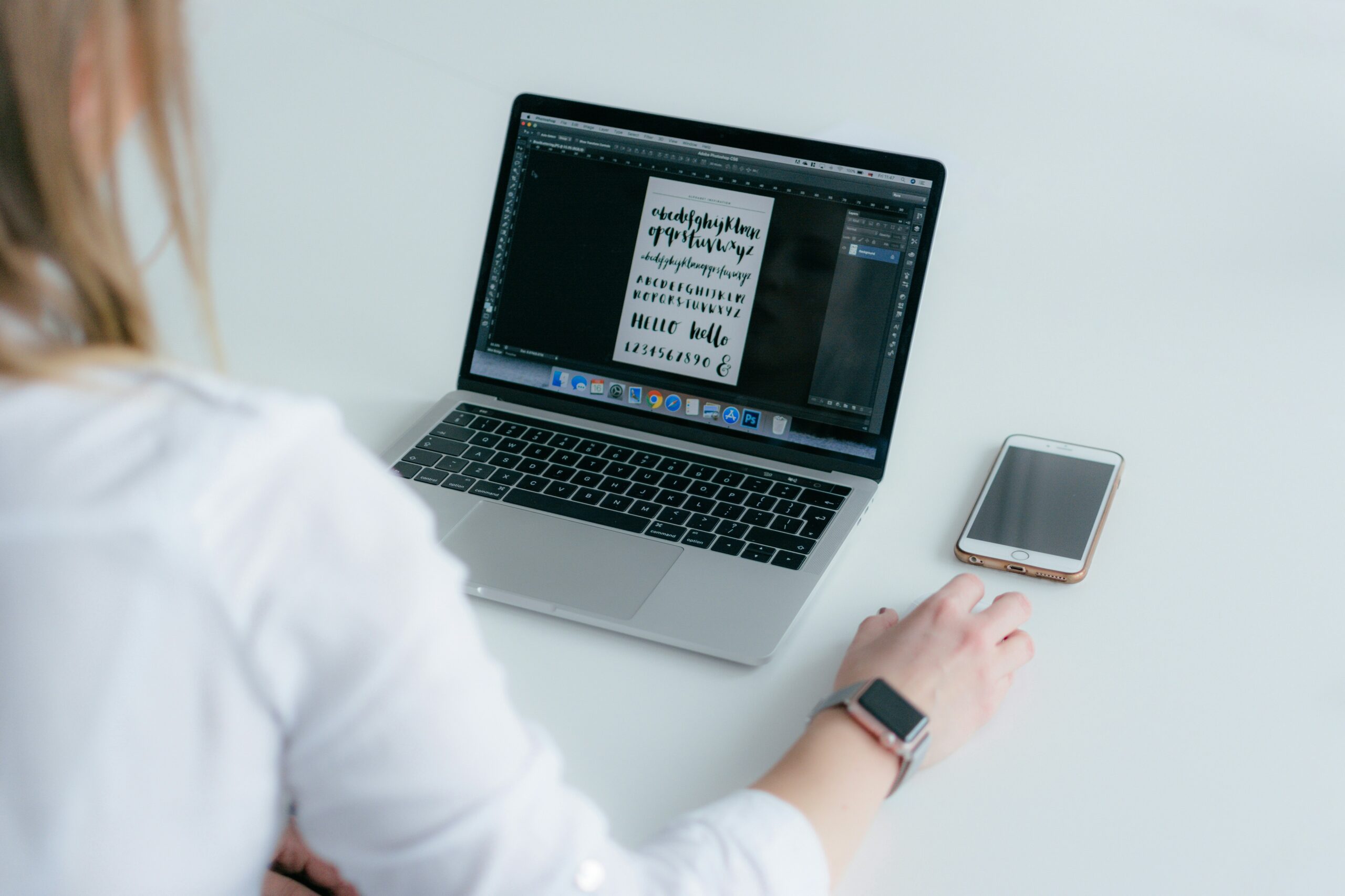 woman using macbook