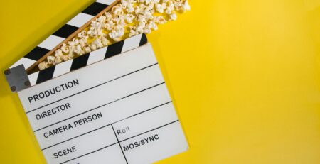 A clapperboard, a dumb slate, clapboard, film clapper, film slate, movie slate, or production slate,