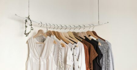 Assorted clothes On Wooden Hangers