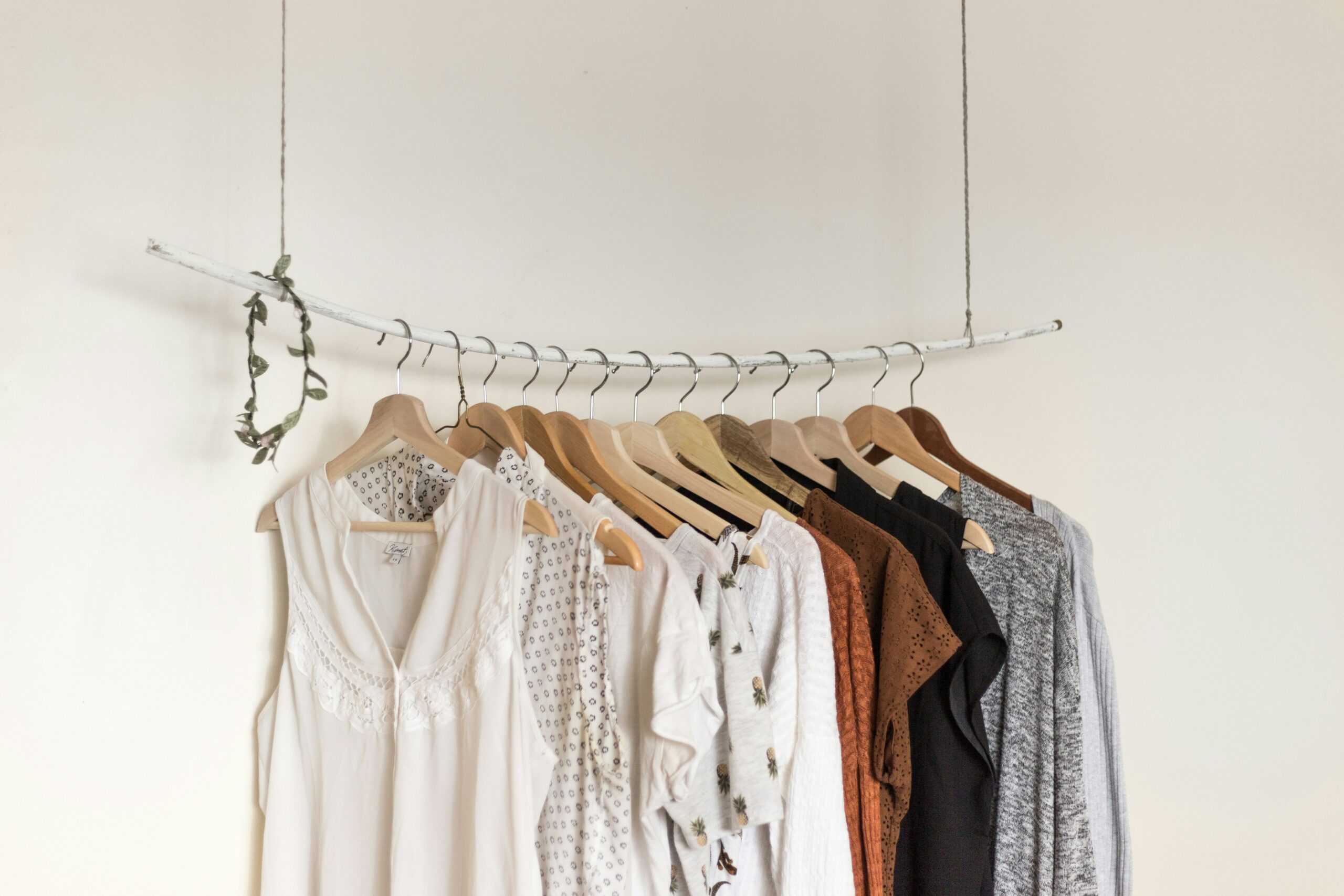 Assorted clothes On Wooden Hangers