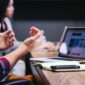 a man hands in front of a macbook