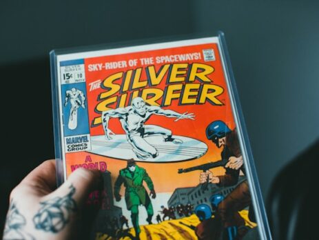 Person holding a comic book