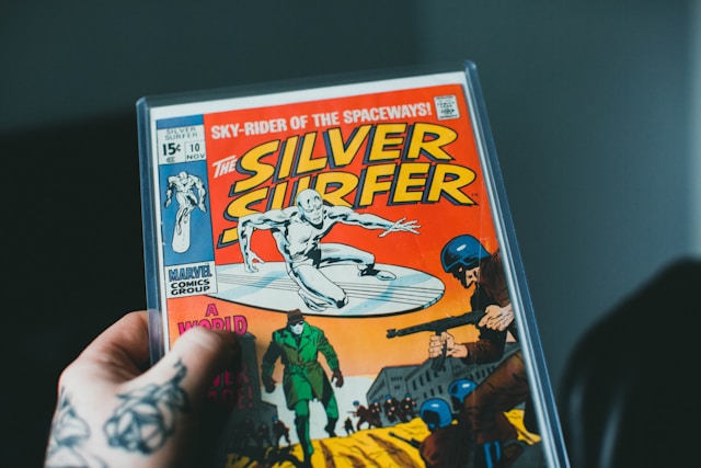 Person holding a comic book