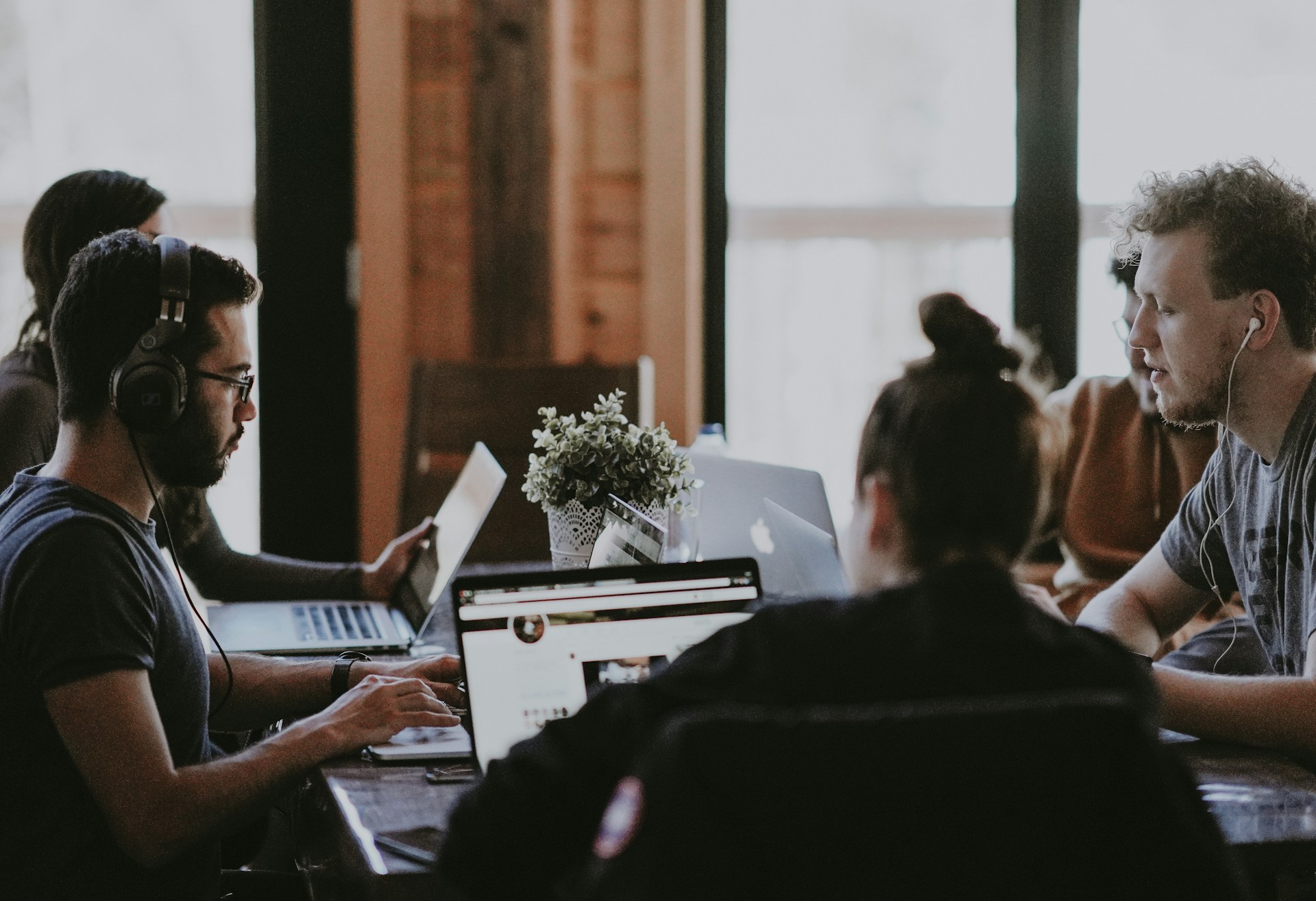 selective focus of people sits in front of table inside room